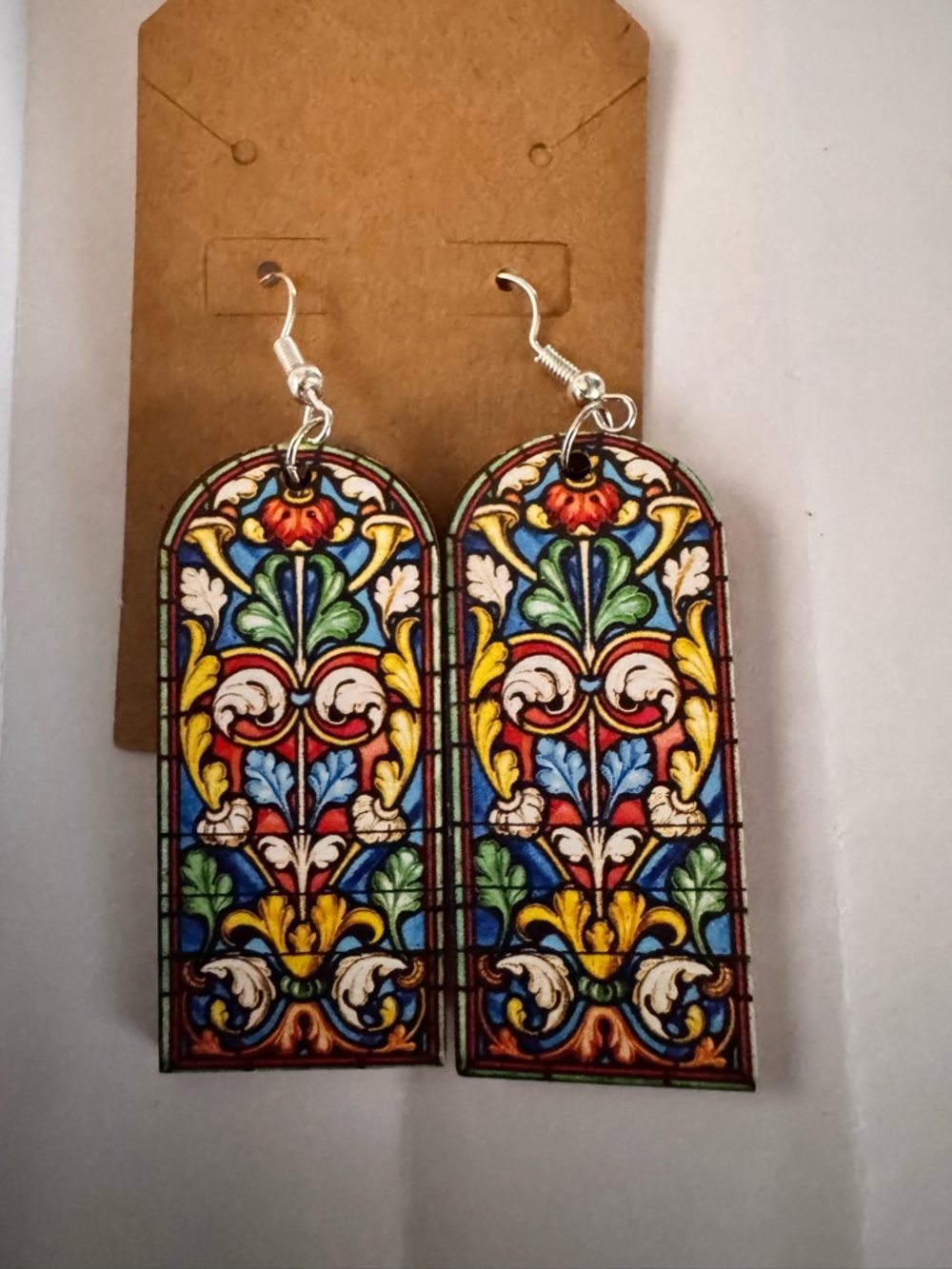 NWOT cathedral window wood dangle earrings feature a stained glass design